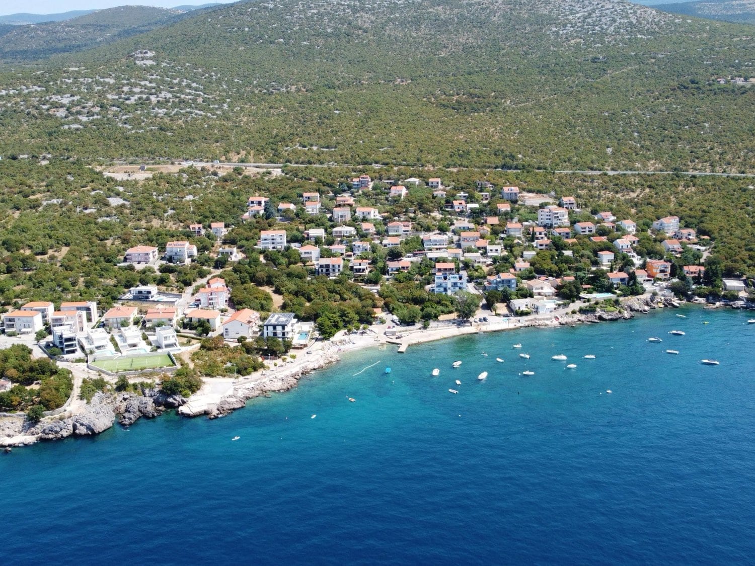 Klenovica beach and cove from the air with boats